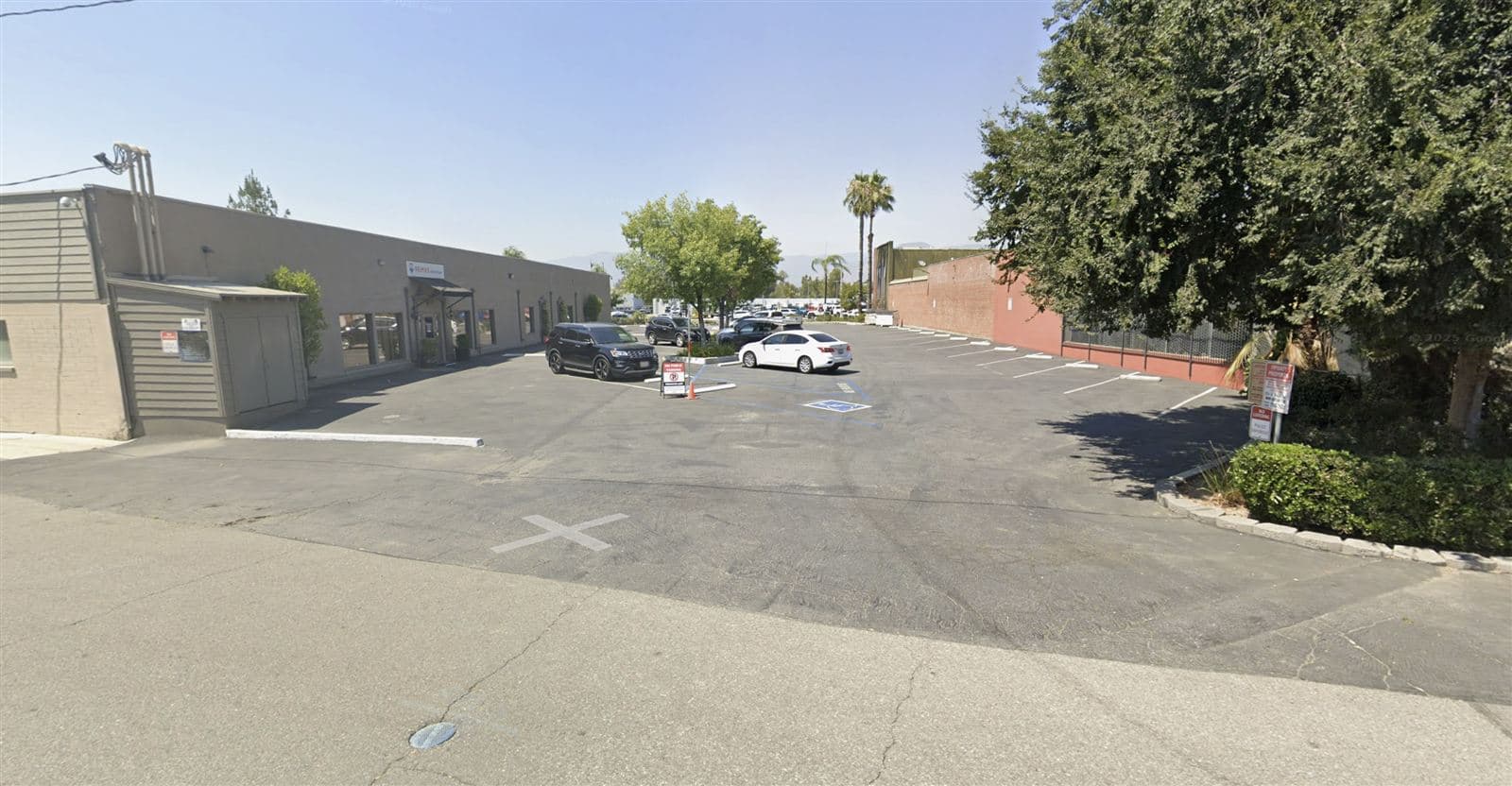 Lot A — the parking lot at 611 W Redlands Blvd